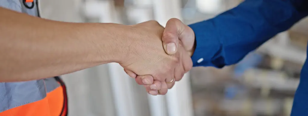 Two Men Builder Architect Shake Hands Construction Site