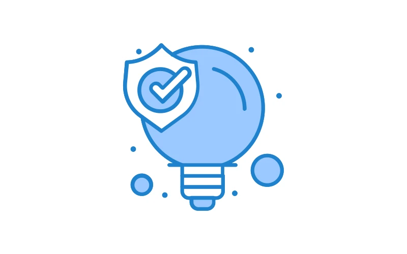 Blue icon of a lightbulb with a shield and checkmark overlay, symbolizing secure design or verified innovation in manufacturing. Associated with MES and APS solutions.